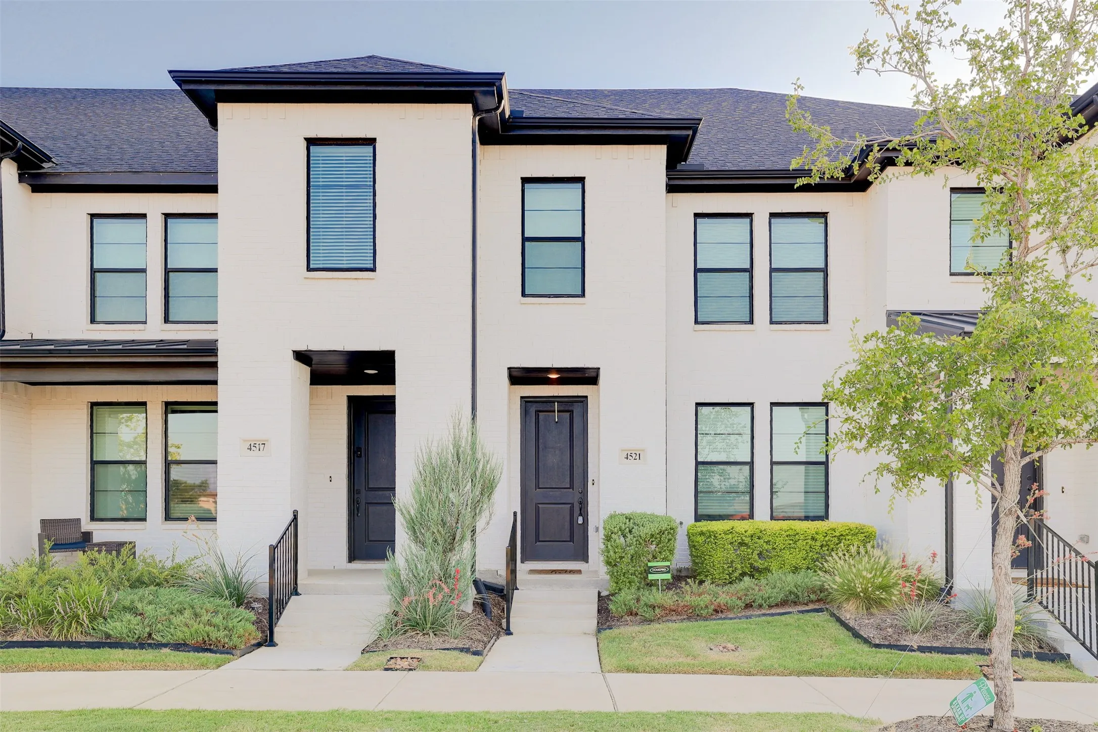 White brick exterior with black framed windows