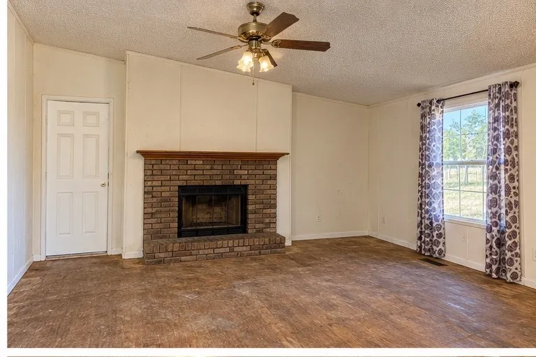 Virtually enhanced photo – debris and personal property digitally removed. Property condition has not been altered.