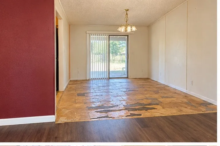 Virtually enhanced photo – debris and personal property digitally removed. Property condition has not been altered.