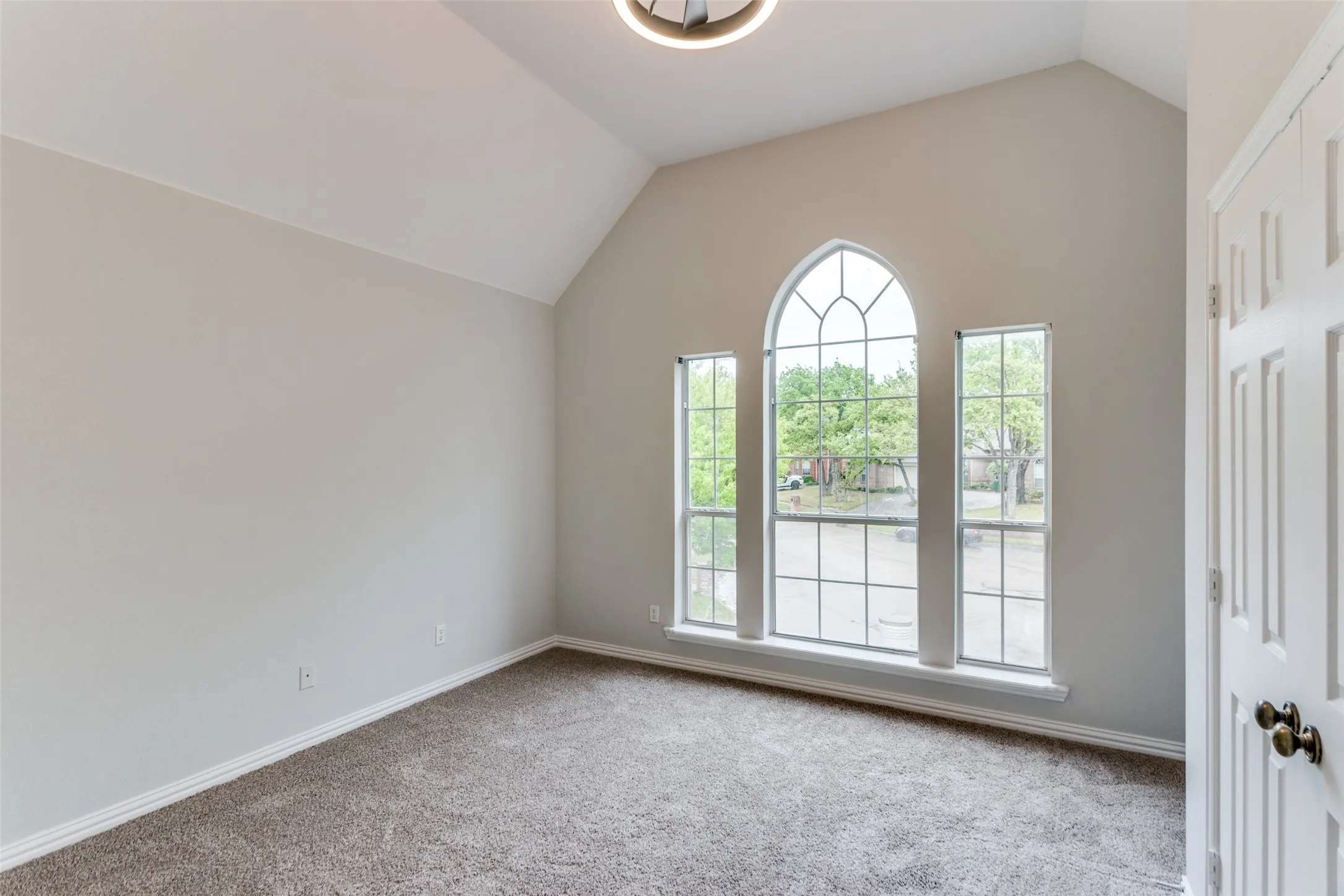 Vaulted ceiling accentuates the room's height