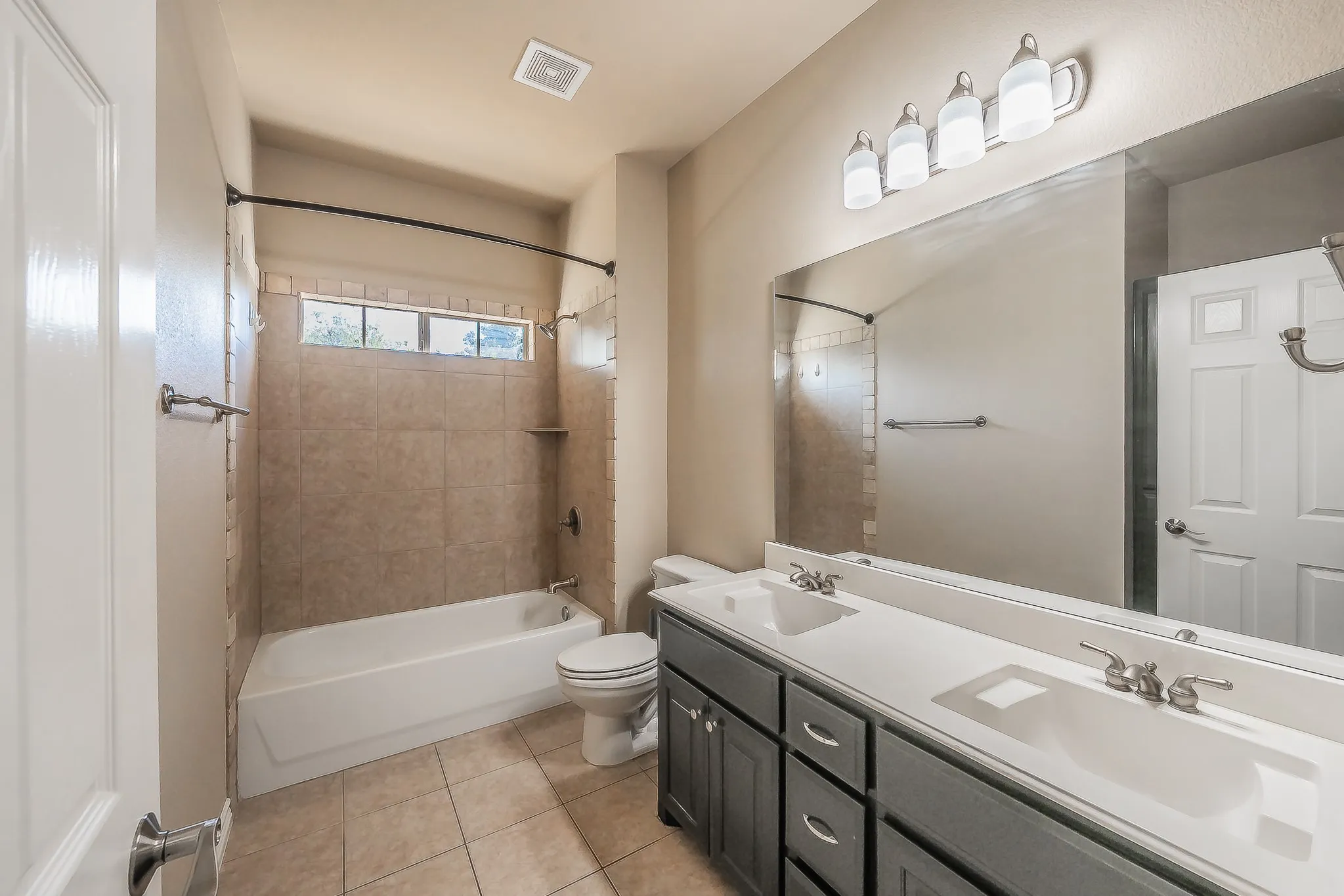 Dual vanity with integrated sinks and brushed nickel faucets