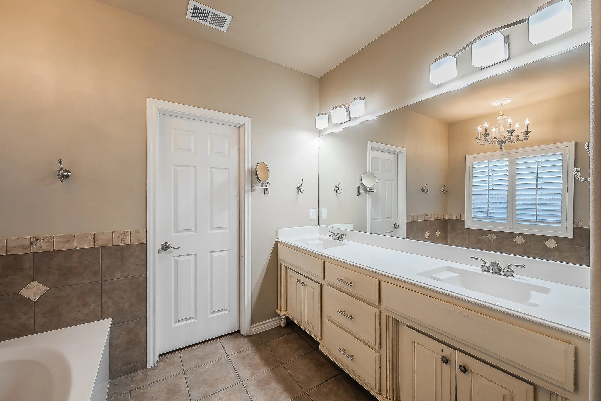 Dual vanity with integrated sinks and chrome fixtures
