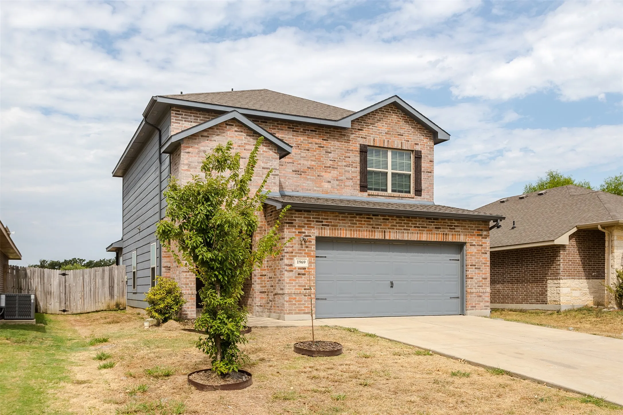 Brick and siding exterior with a two-story design