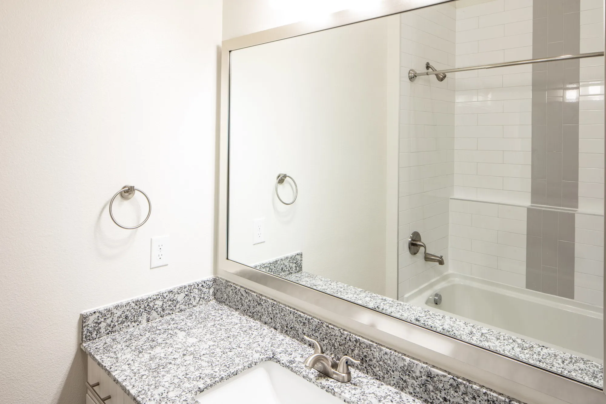 Bathroom with vanity and tiled shower / bath combo