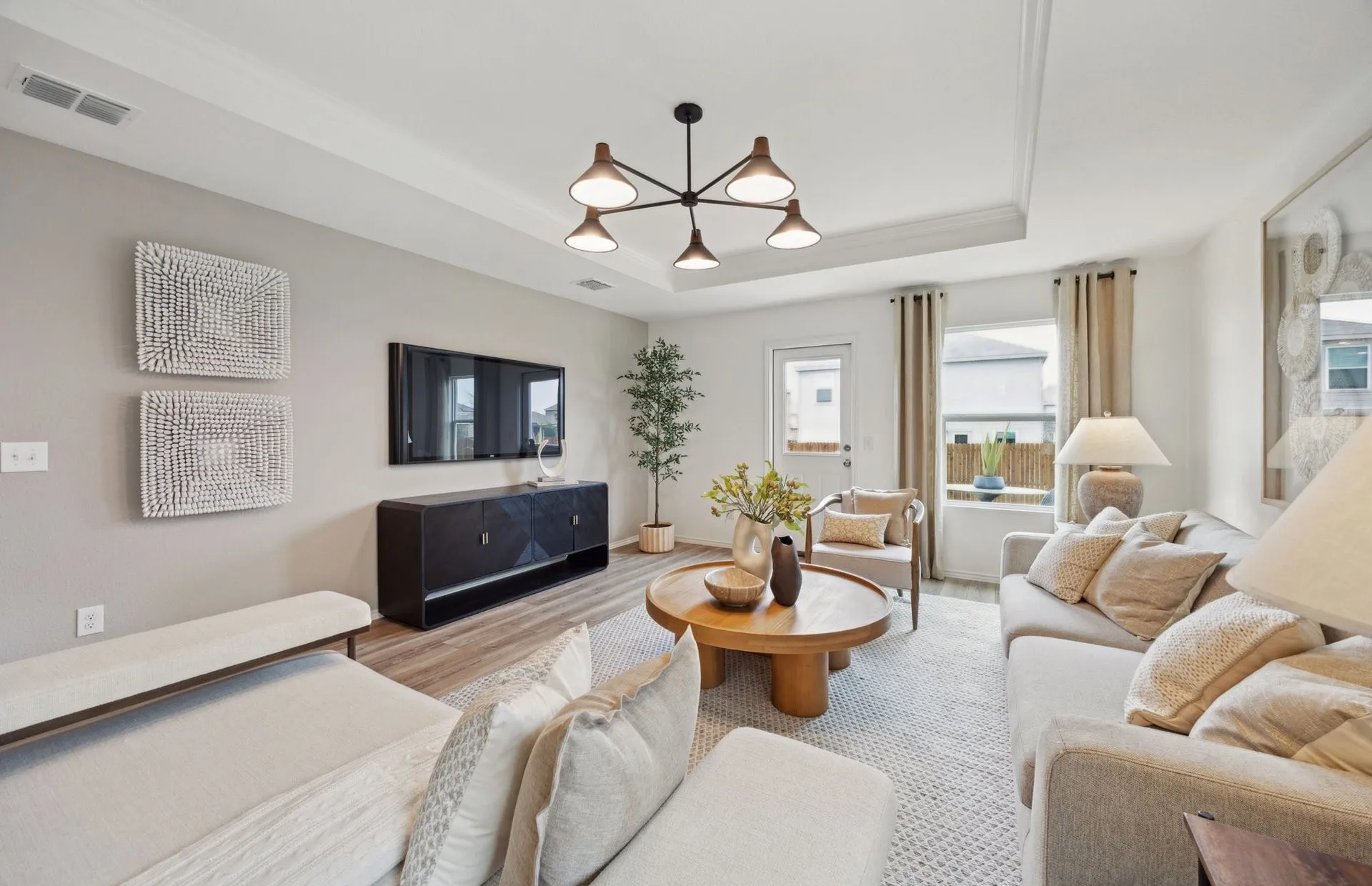 *Model Representation - Spacious gathering room with large windows