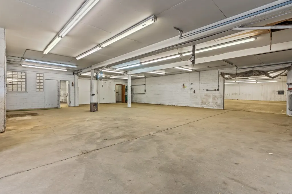 Concrete flooring with white brick walls