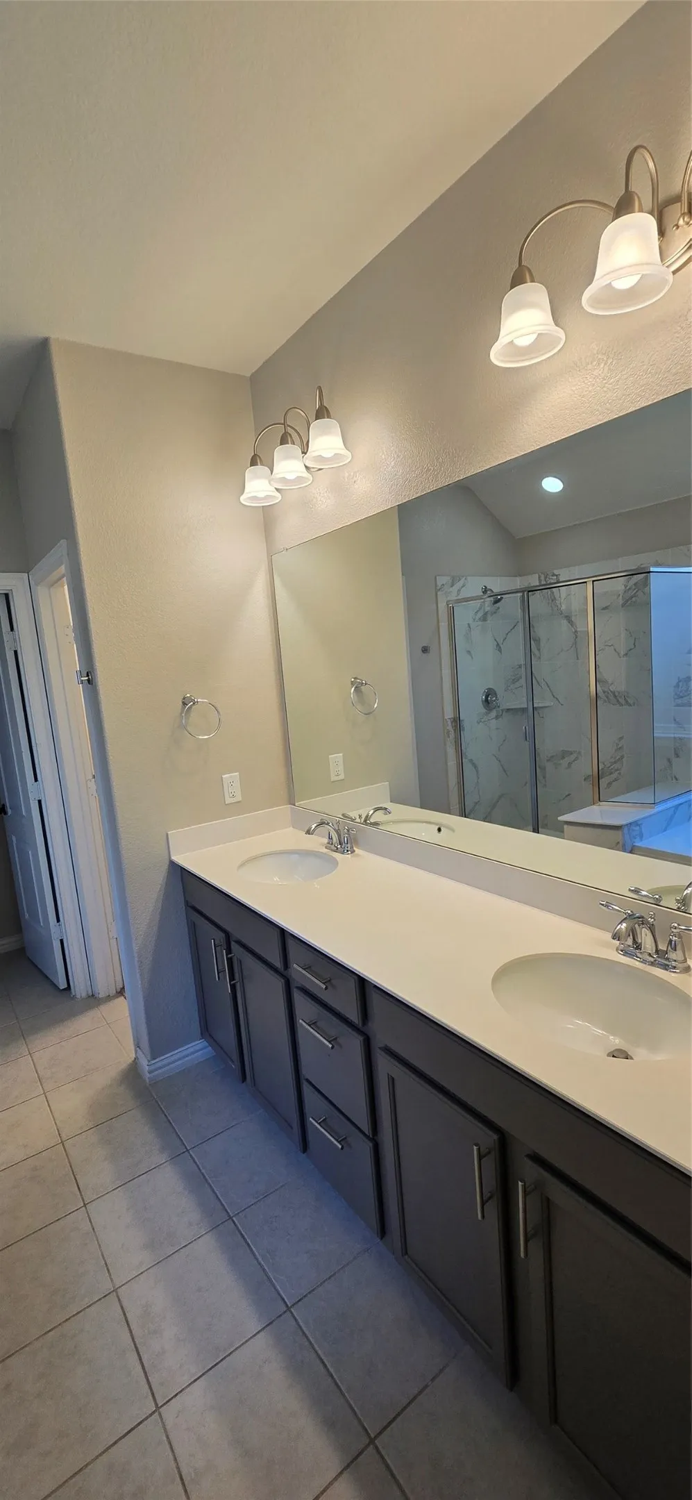 Dual vanity with undermount sinks and chrome fixtures