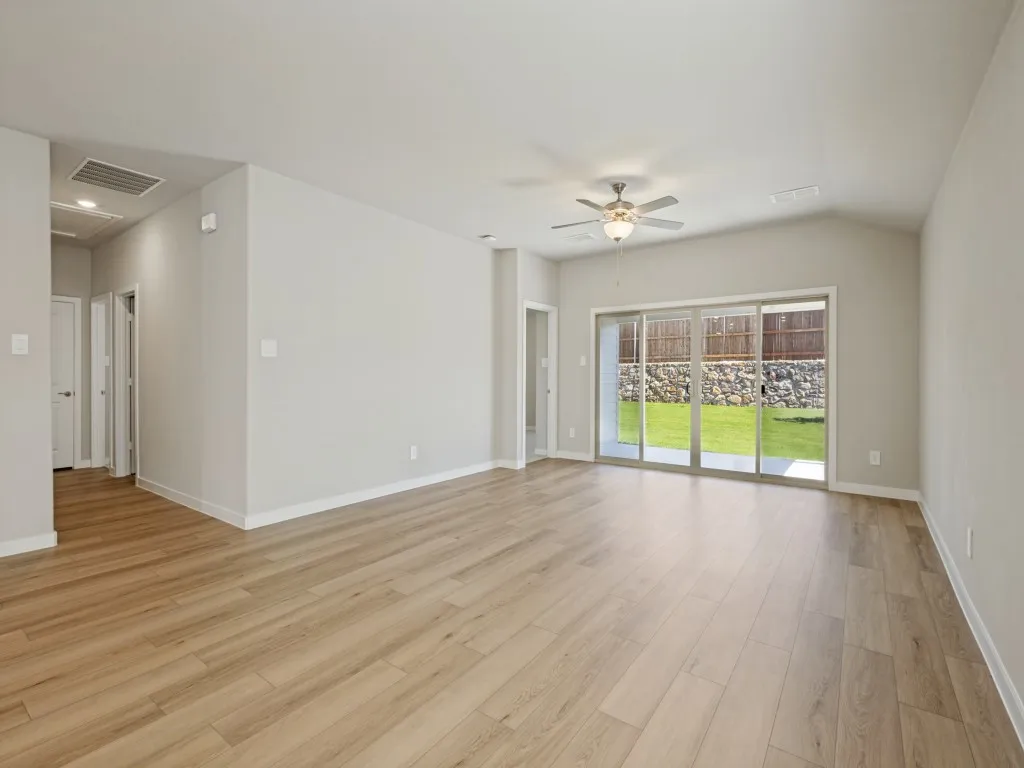 Living room with sliding doors that open to covered patio