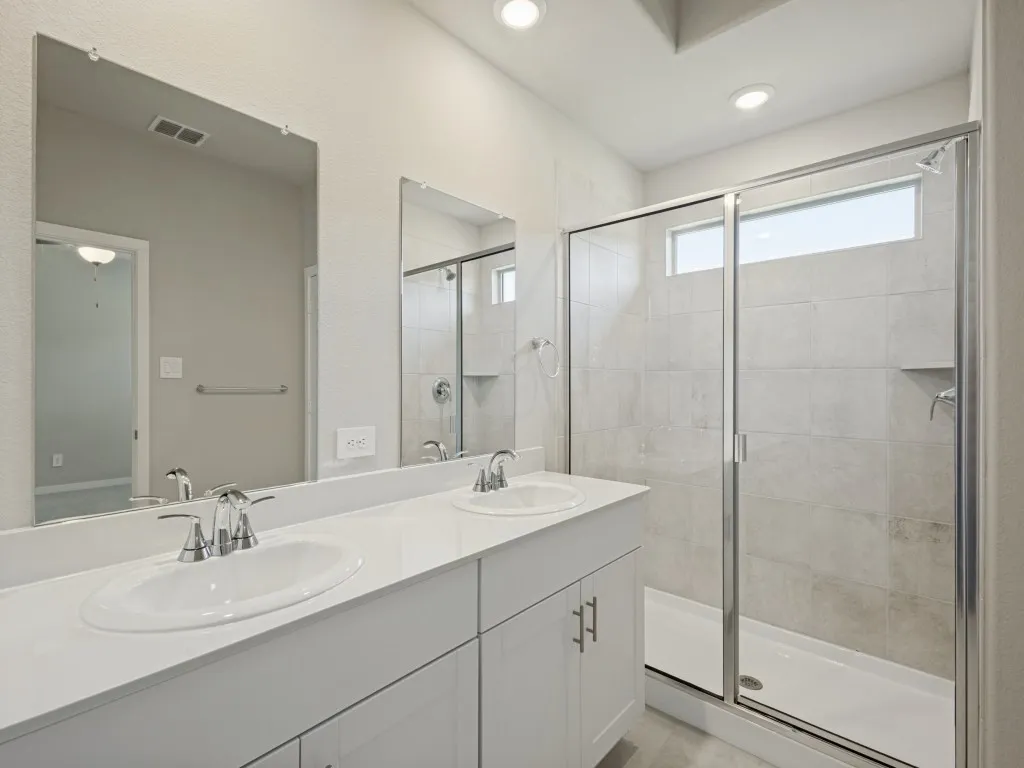 Big walk in shower with dual vanities