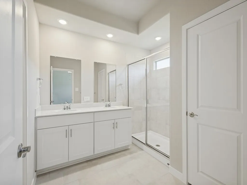 Dual vanities, standing shower and linen closet