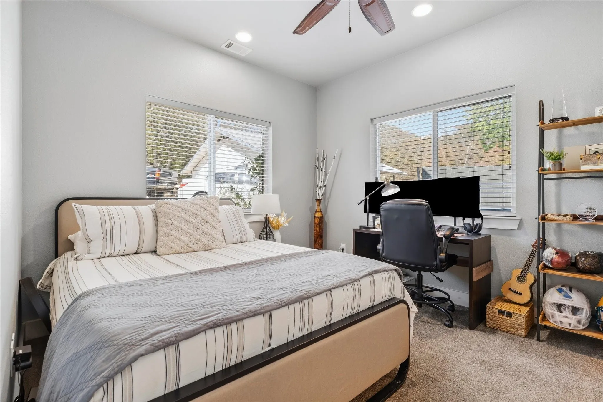 Spacious room featuring neutral carpeting and light gray walls