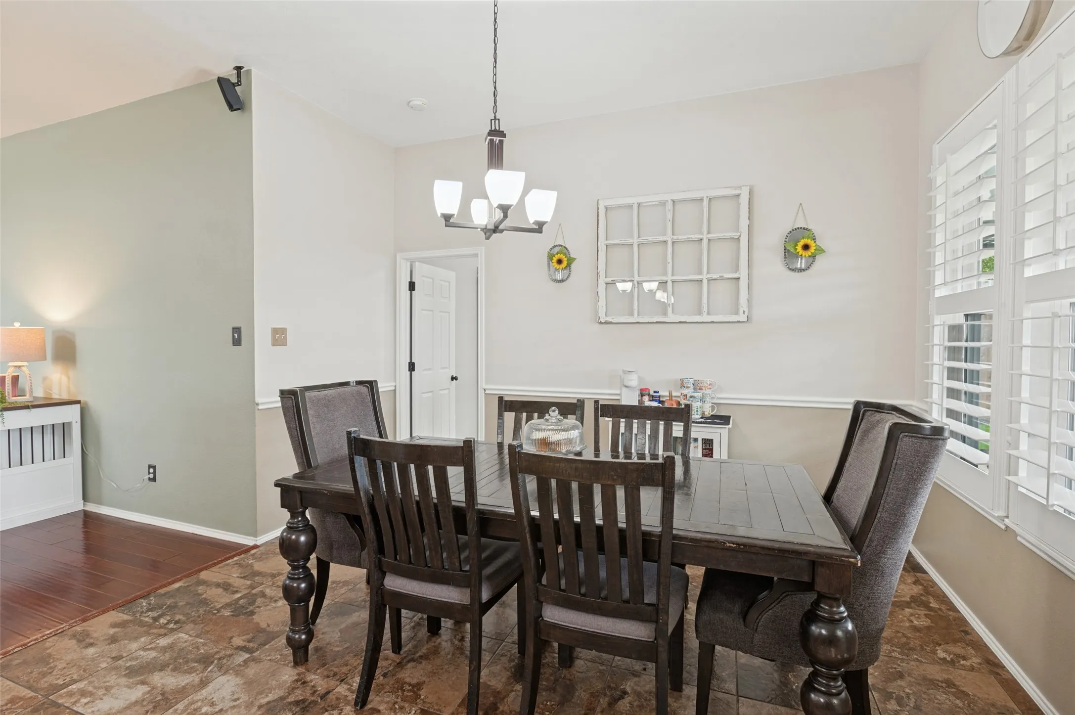 Recessed lighting, crown molding, and two-tone wall paint