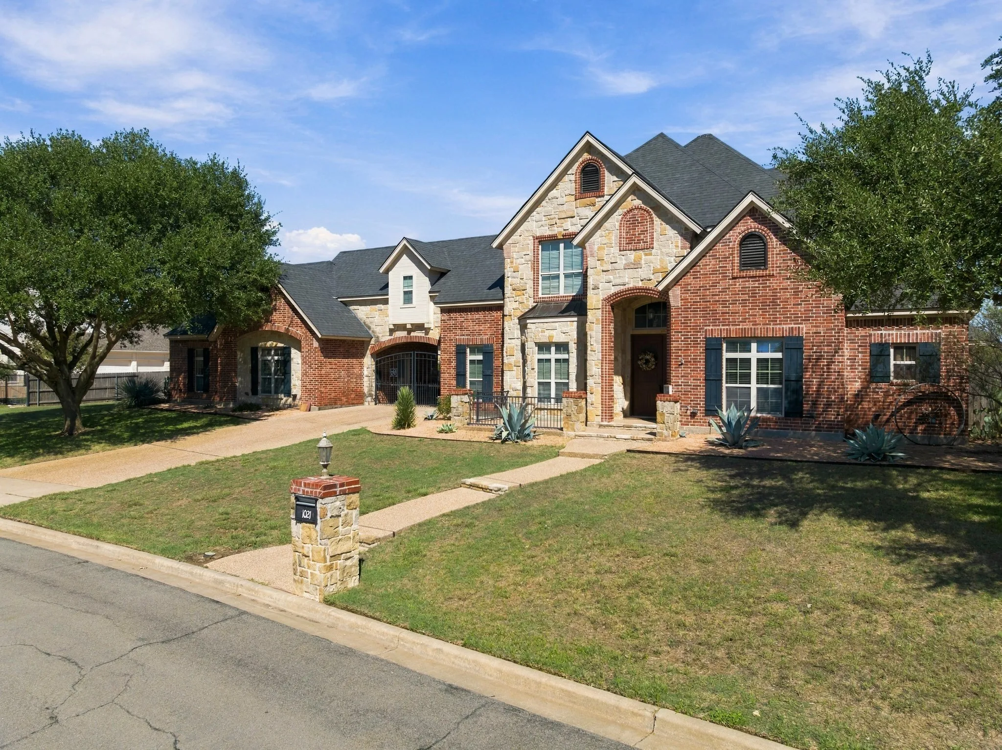 Brick and stone facade with arched entryways