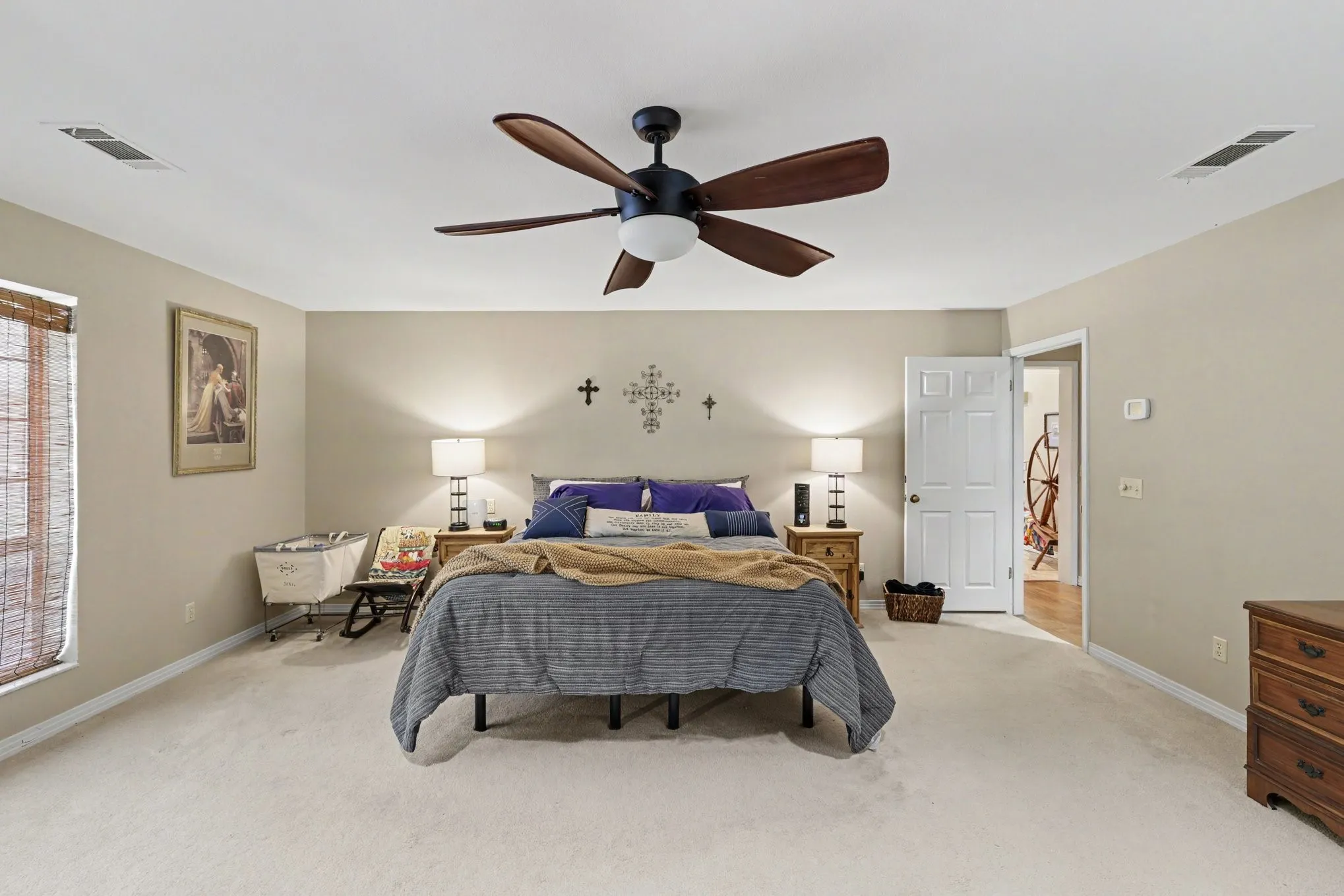 Recessed lighting, ceiling fan with light fixture, neutral carpeting, paneled interior door, and window with natural wood blinds
