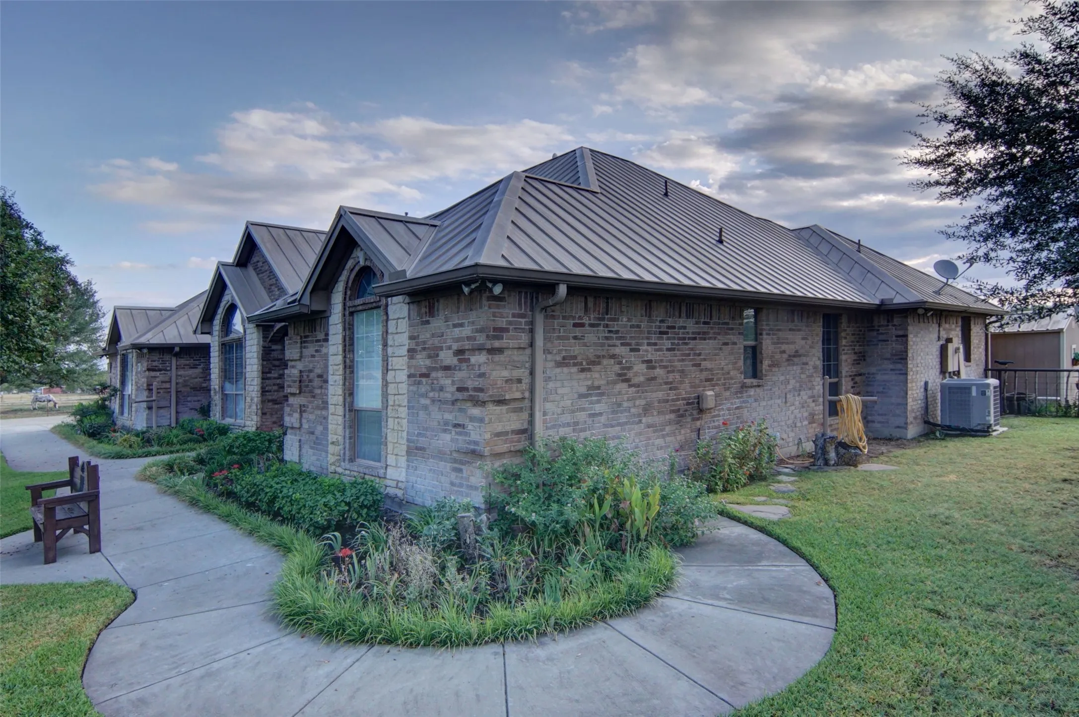 Brick exterior with stone accents and arched windows