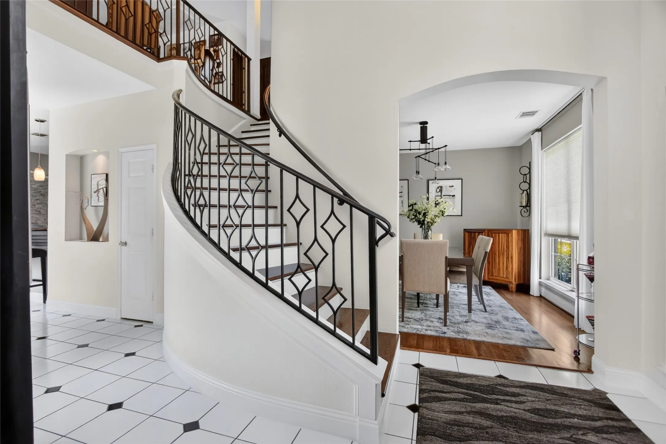 Step inside to a breathtaking two-story foyer that immediately sets the tone for the home. Soaring ceilings and an abundance of natural light create a grand, open feel, while the elegant staircase serves as a stunning architectural focal point.