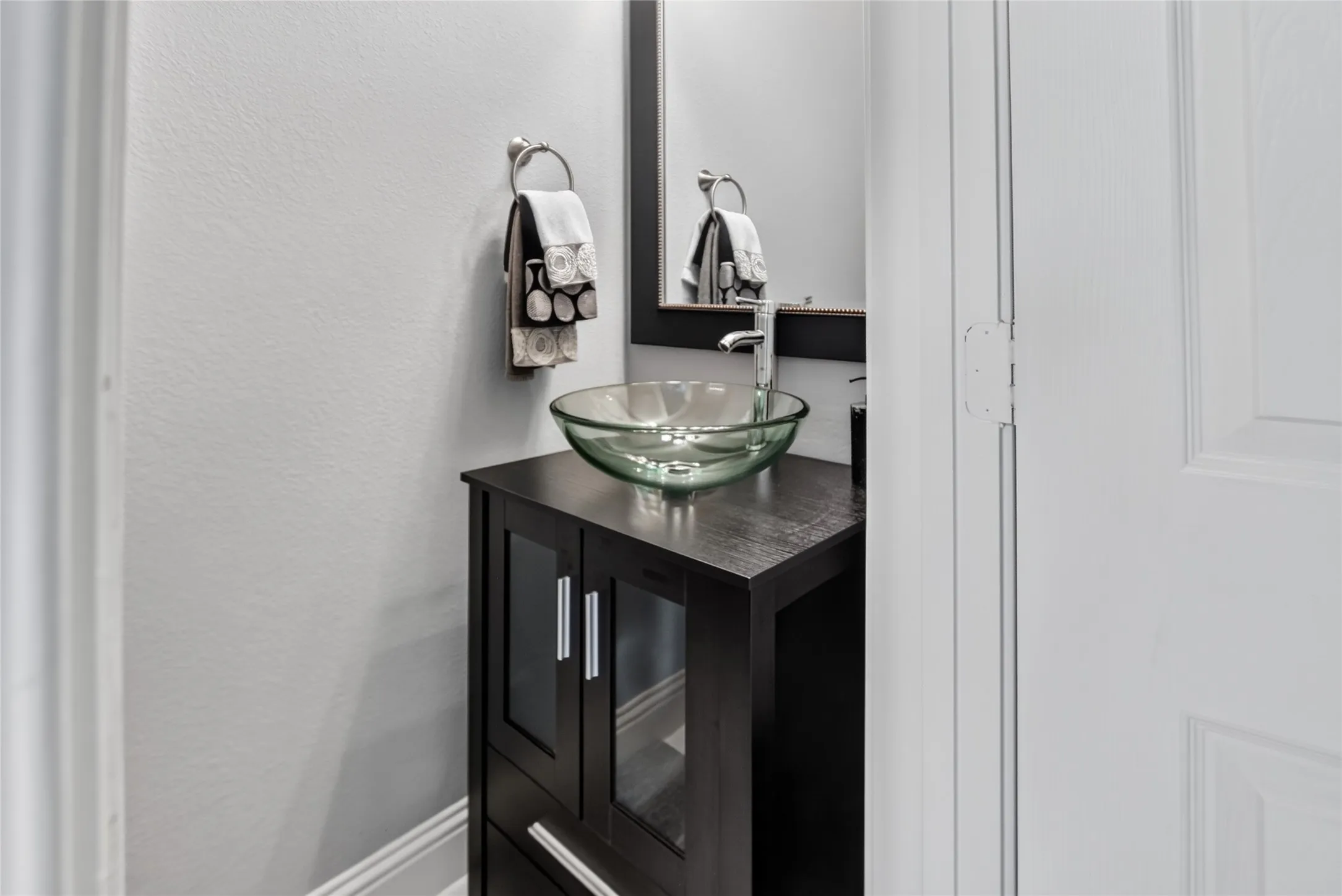 Updated half bath down conveniently located near living room.