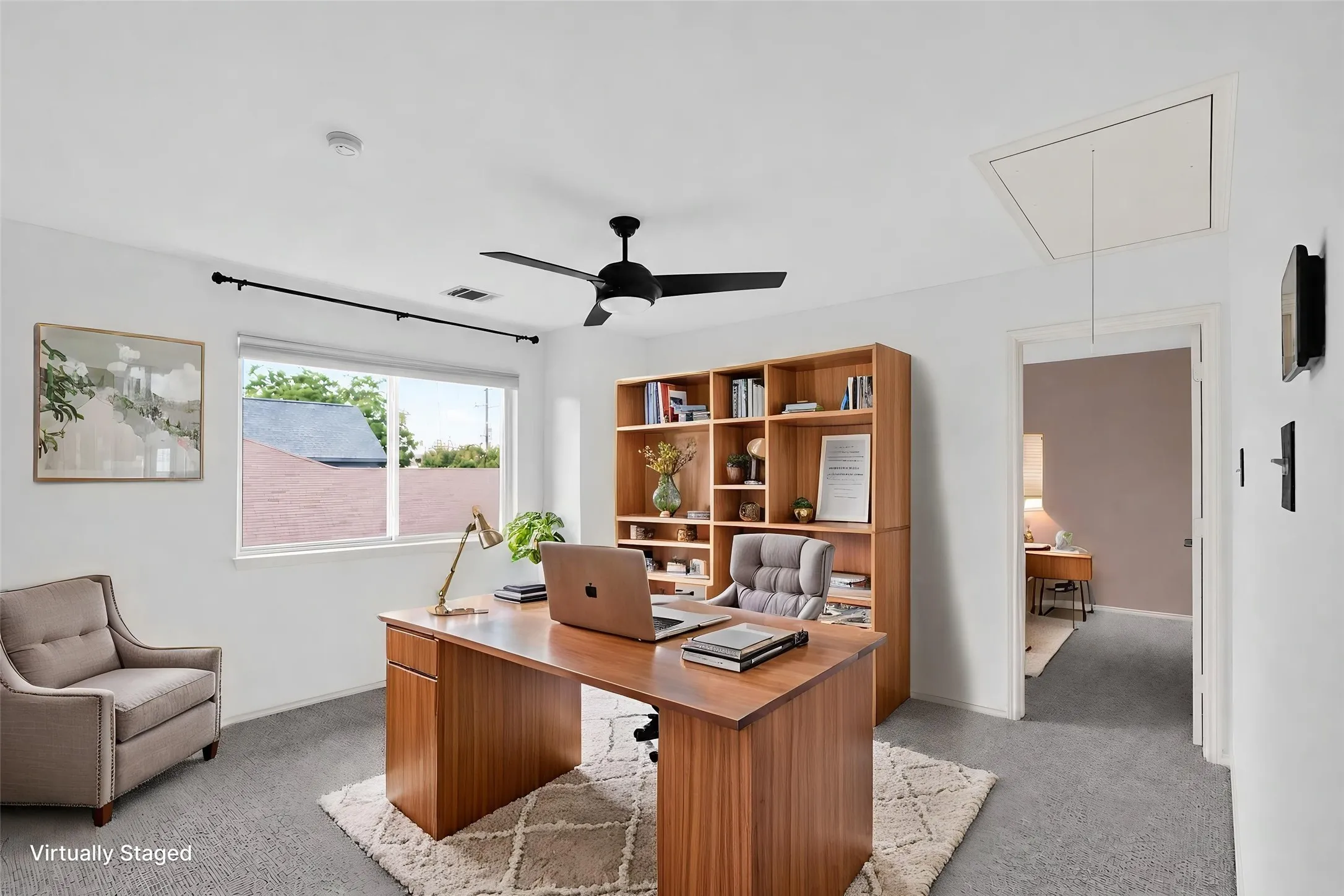 Spacious loft at the top of the staircase. Great for a home office or 2nd living area or exercise area.  Carpeted, ceiling-fan light combo. Two additional bedrooms and Jack N Jill bath also located on 2nd floor.