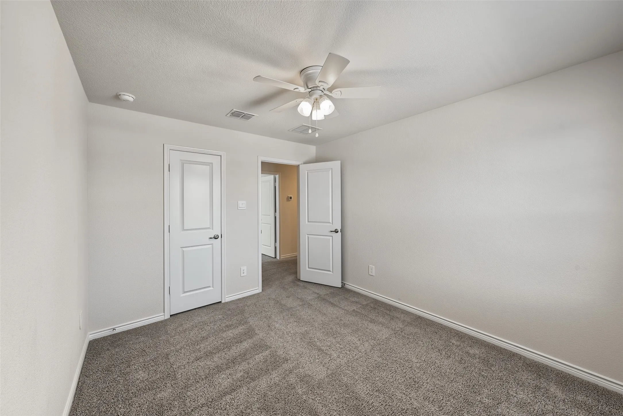 Neutral-toned carpeting throughout