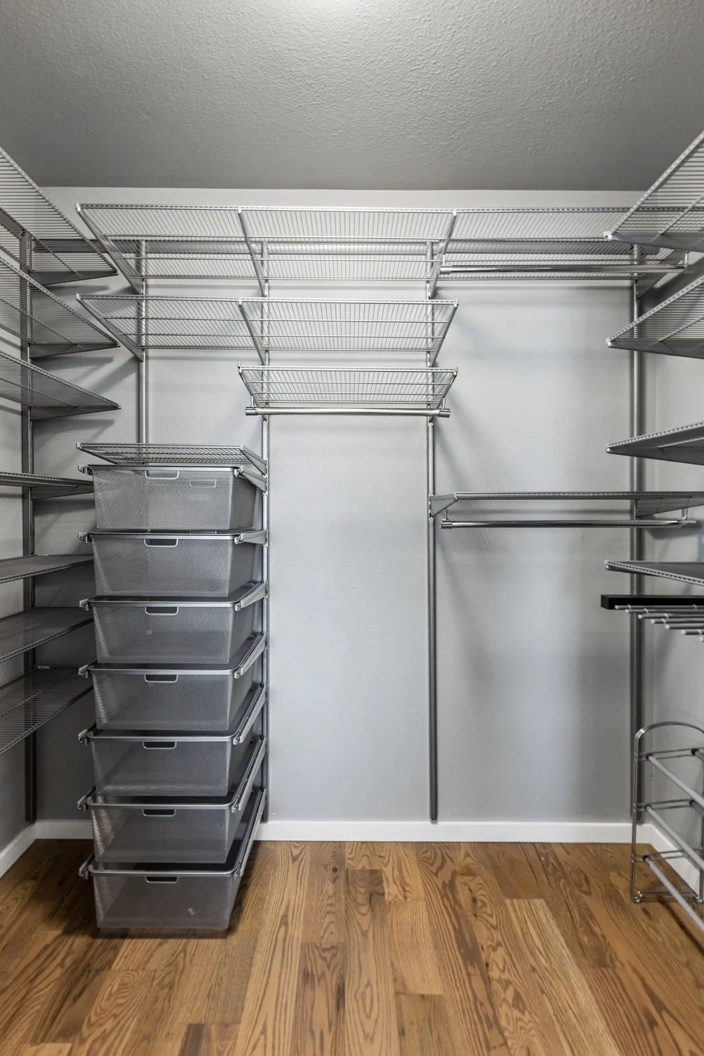 Custom walk-in closet in primary bedroom