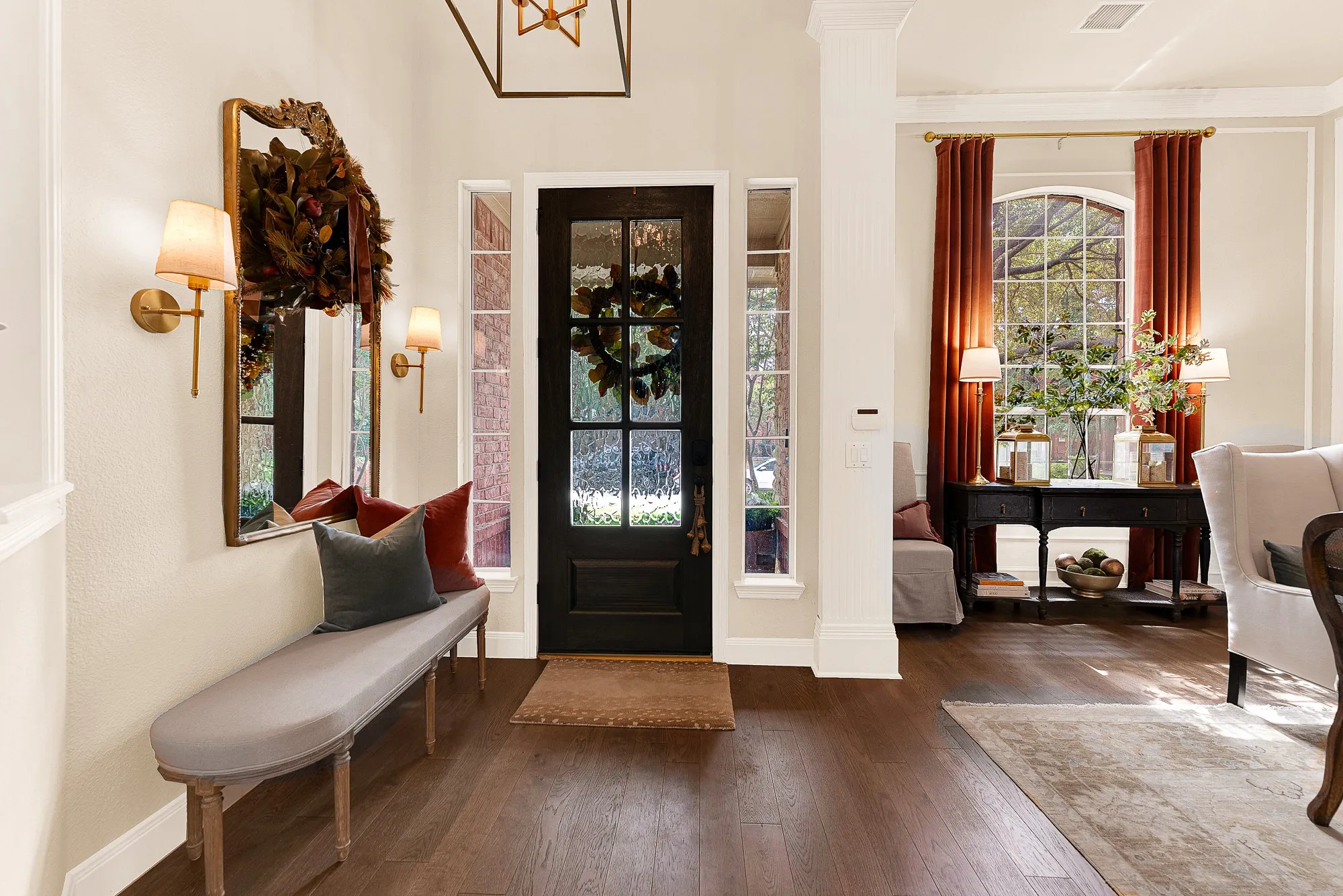 The handsome front door replaced in 2025 stands alongside glass sidelights and plantation shutters, casting bright rays over a spacious foyer. Envision kicking off your shoes after a quick neighborhood stroll and taking a quiet moment to unwind.