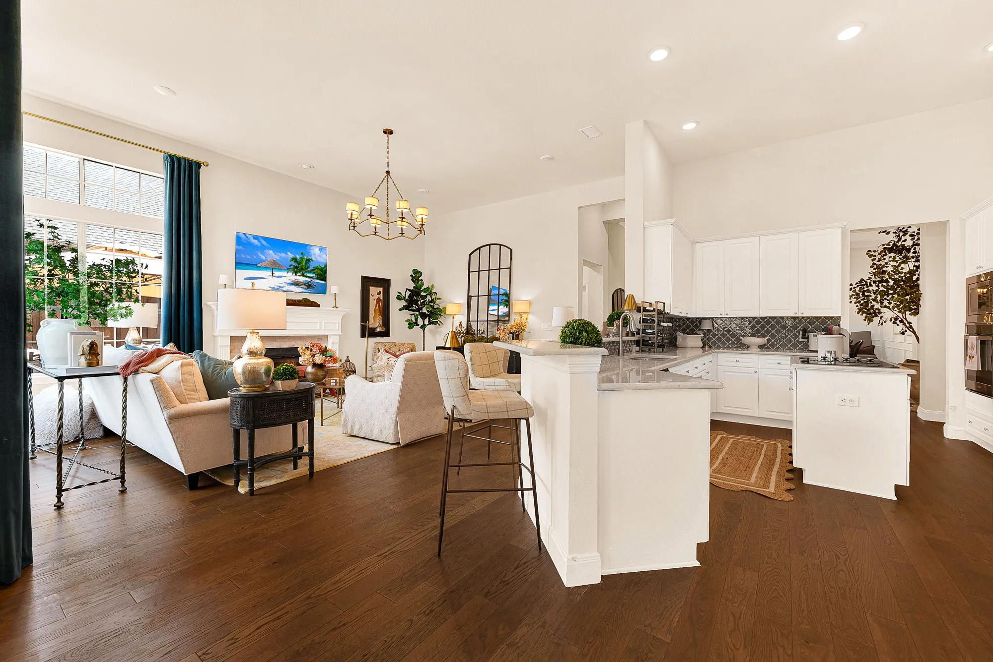 An open, two-tiered breakfast bar seamless connects the kitchen workspace directly to the high-ceilinged family room. Enjoy chatting with guests over hors d'oeuvres while putting the finishing touches on dinner.