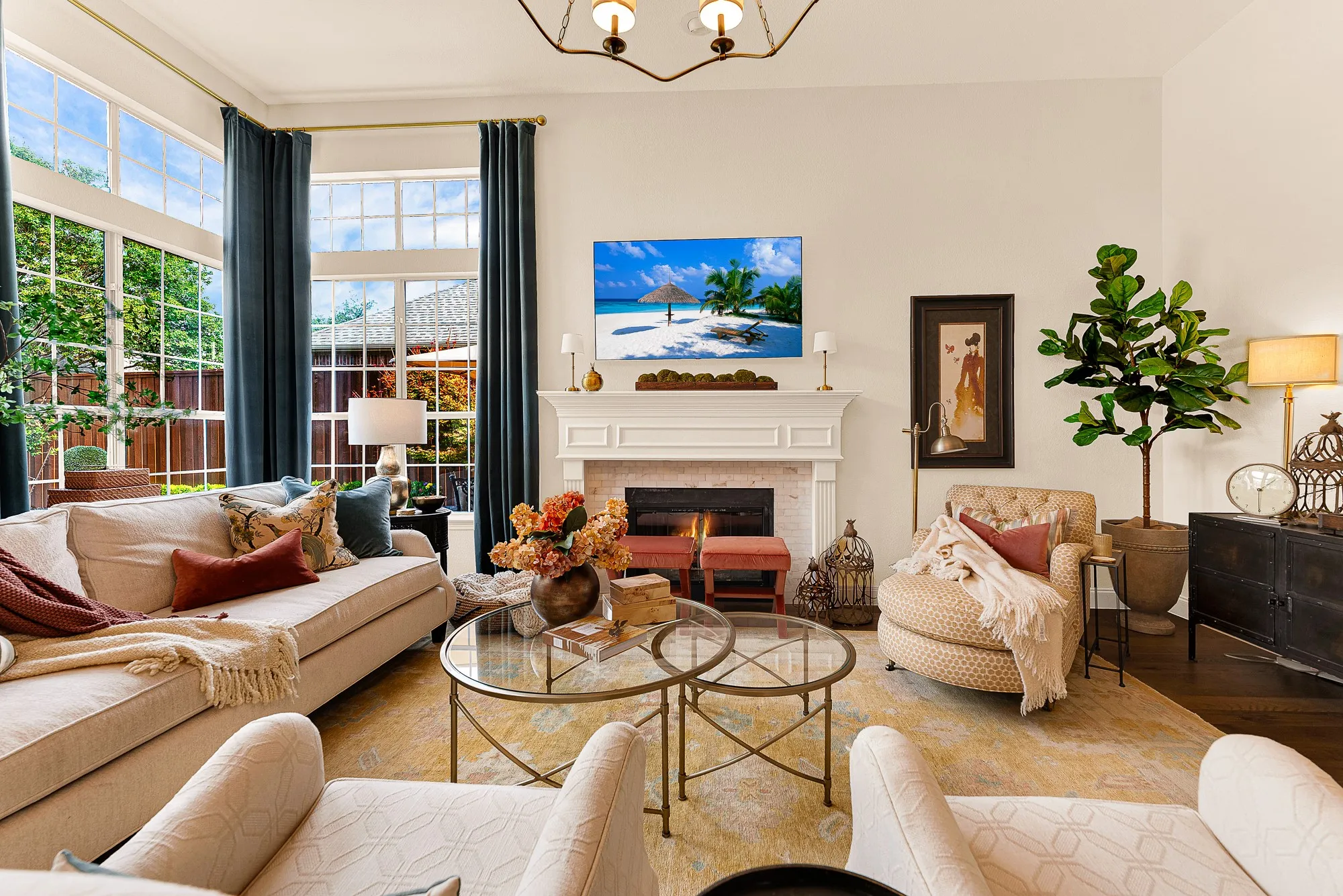 Floor-to-ceiling glass captures picturesque views of the backyard and pool, seamlessly connecting indoor comfort with outdoor scenery. Gather with family for cozy movie nights framed by sparkling patio vistas outside.