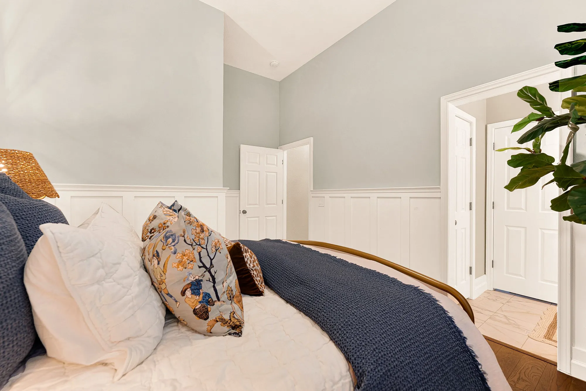 Crisp classic paneling runs along the lower walls,
seamlessly anchoring the doorways and warm wood flooring. Imagine visiting family members enjoying a peaceful morning reading session in their private retreat