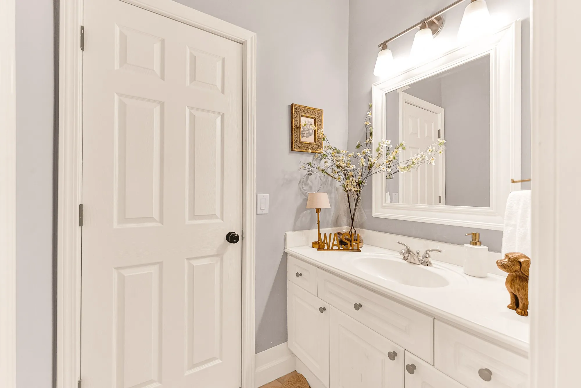 A guest bath remodeled in 2025 offers a bright vanity space enhanced by refined trim molding and soft overhead lighting. Help visitors feel pampered with a refreshing, spa-like start to their​​‌​​​​‌​​‌‌​‌‌​​​‌‌​‌​‌​‌​​​‌​​ day.