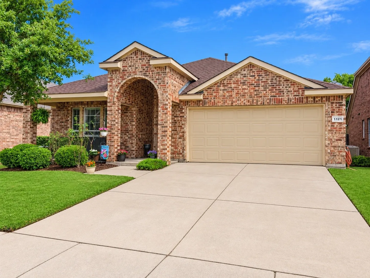 2 car garage and driveway with ample parking space.