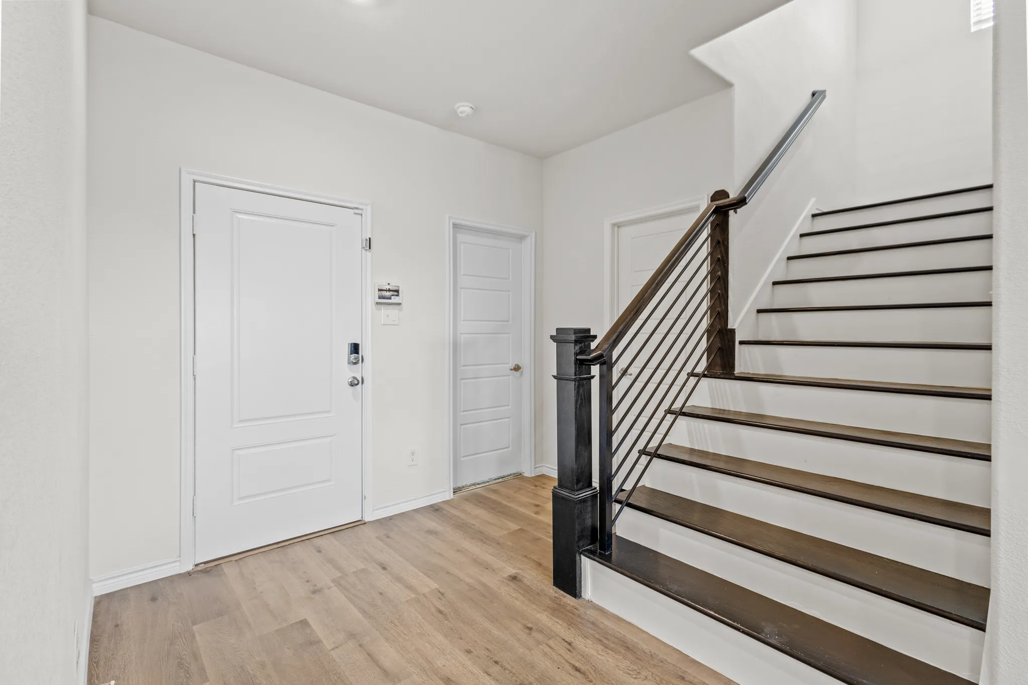 Wood-finish flooring throughout the entryway