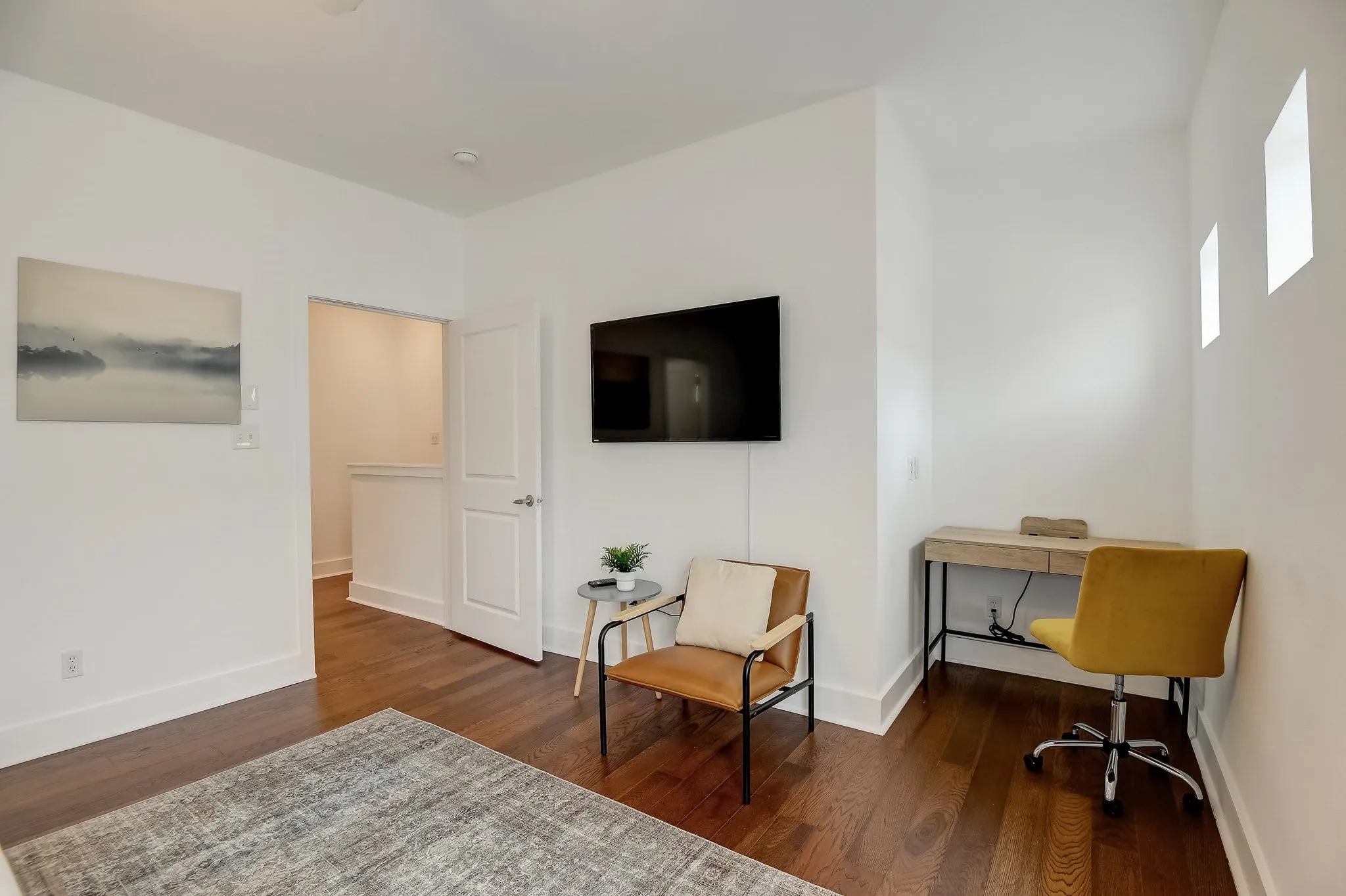 Office space featuring wood finished floors and baseboards