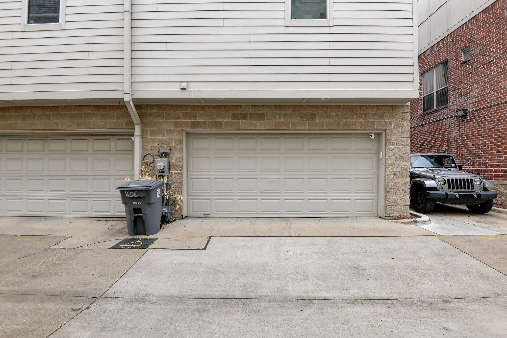 Garage featuring concrete driveway