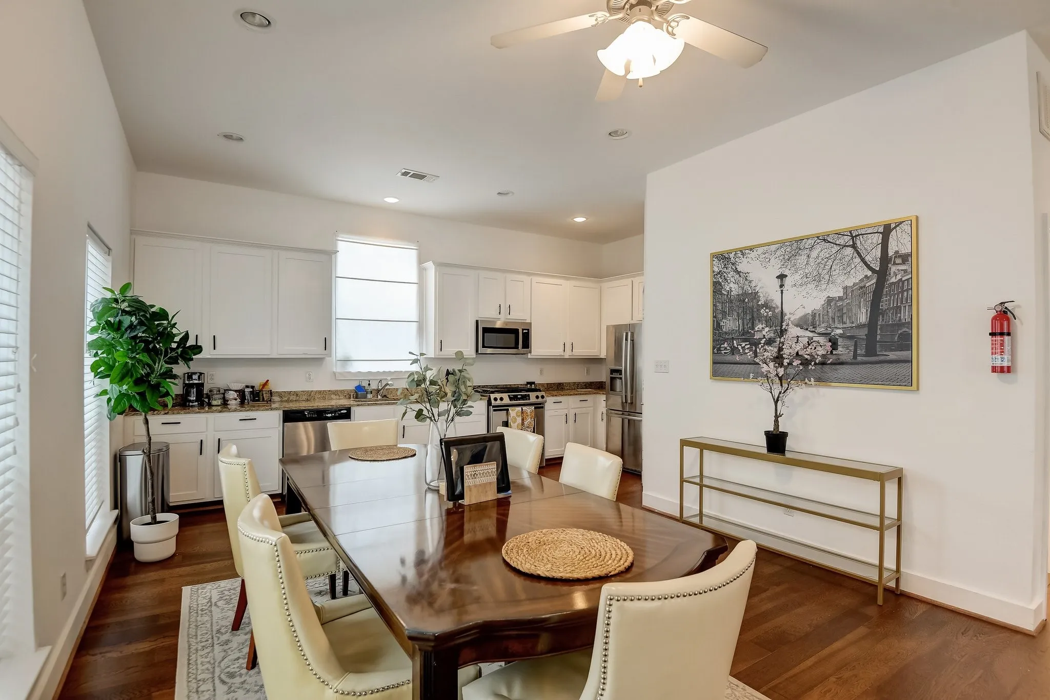 Dining room featuring plenty of natural light, ceiling fan, dark wood-style floors, baseboards, and recessed lighting