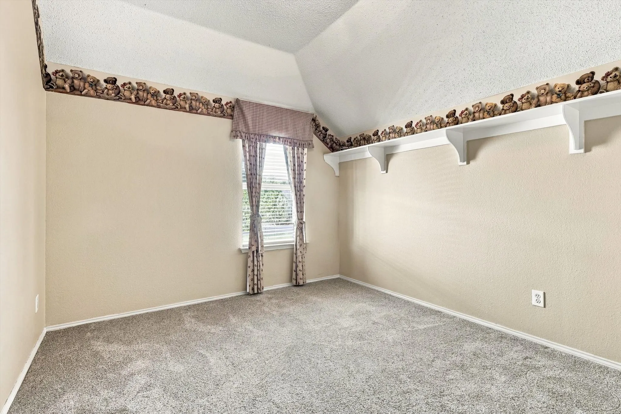 Neutral-toned walls complement a textured carpet