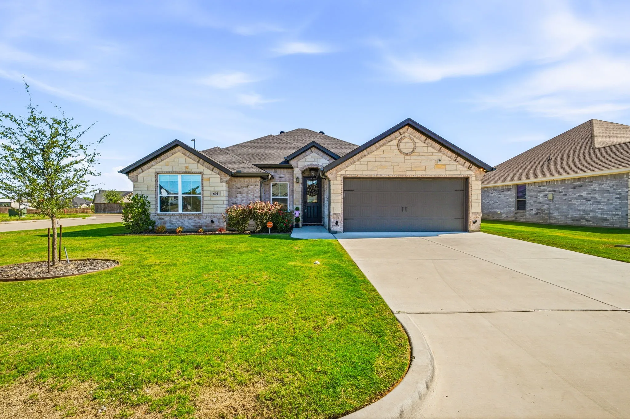 Stone and brick veneer exterior with a gabled roof