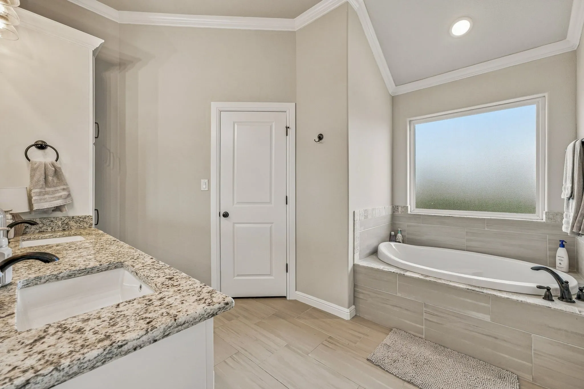 Dual vanity with granite countertops and undermount sinks