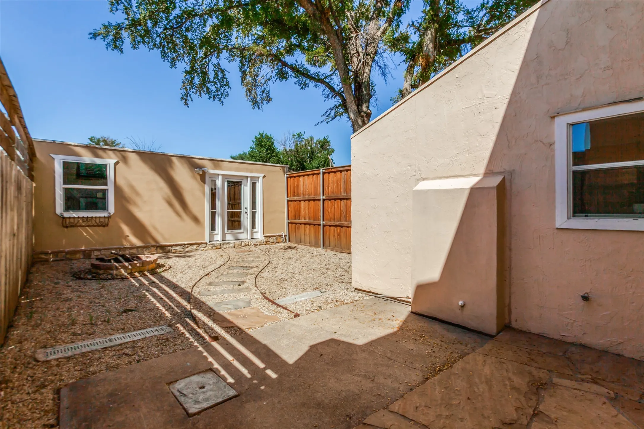 351 Vally Park Dr. - Back of home featuring a low-maintenance backyard with a fire pit, perfect for relaxing or entertaining outdoors.