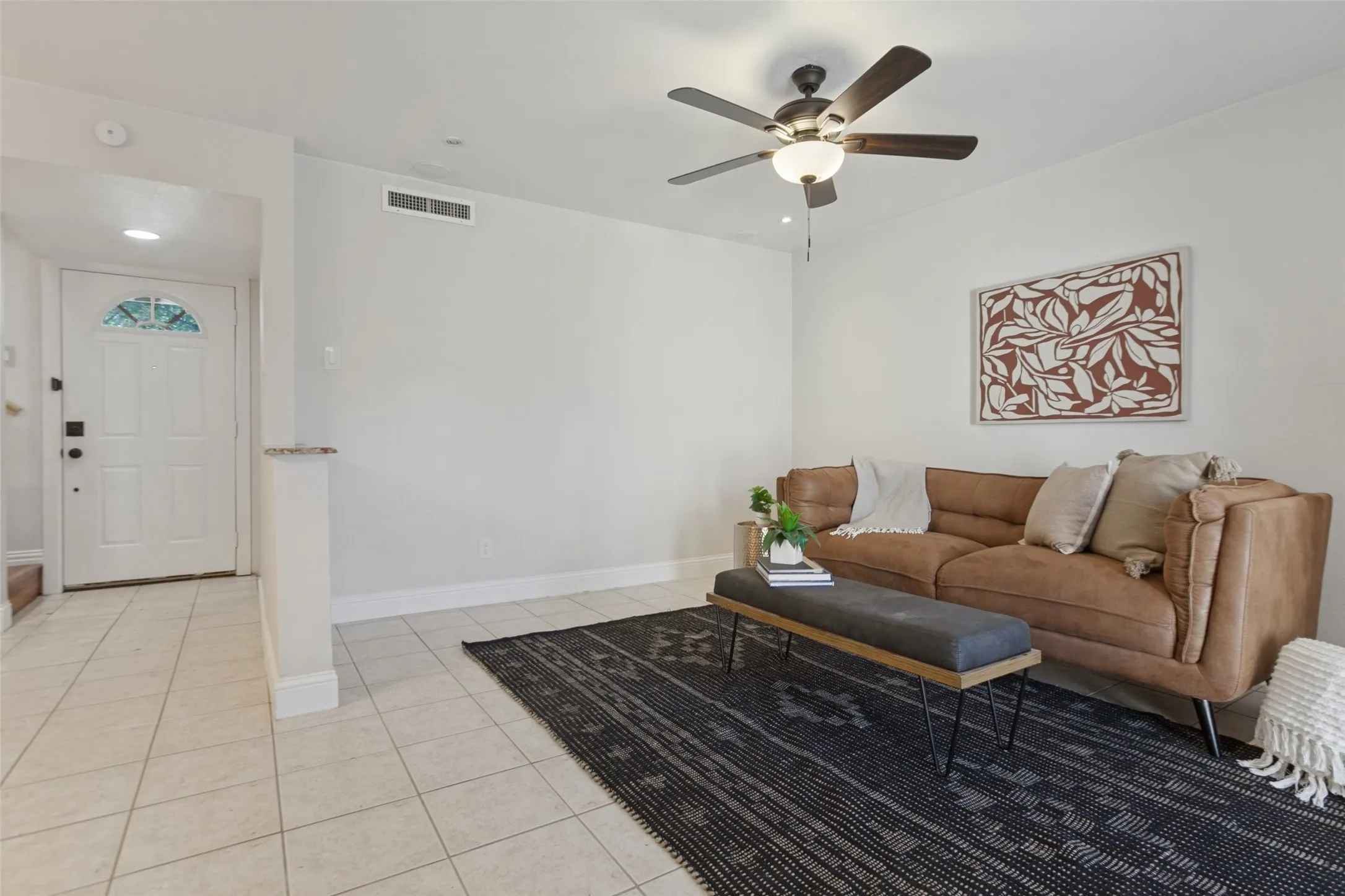 351 Vally Park Dr. - Updated living area featuring fresh paint, newer tile flooring, ceiling fan and French doors with built-in blinds that open to the back patio.