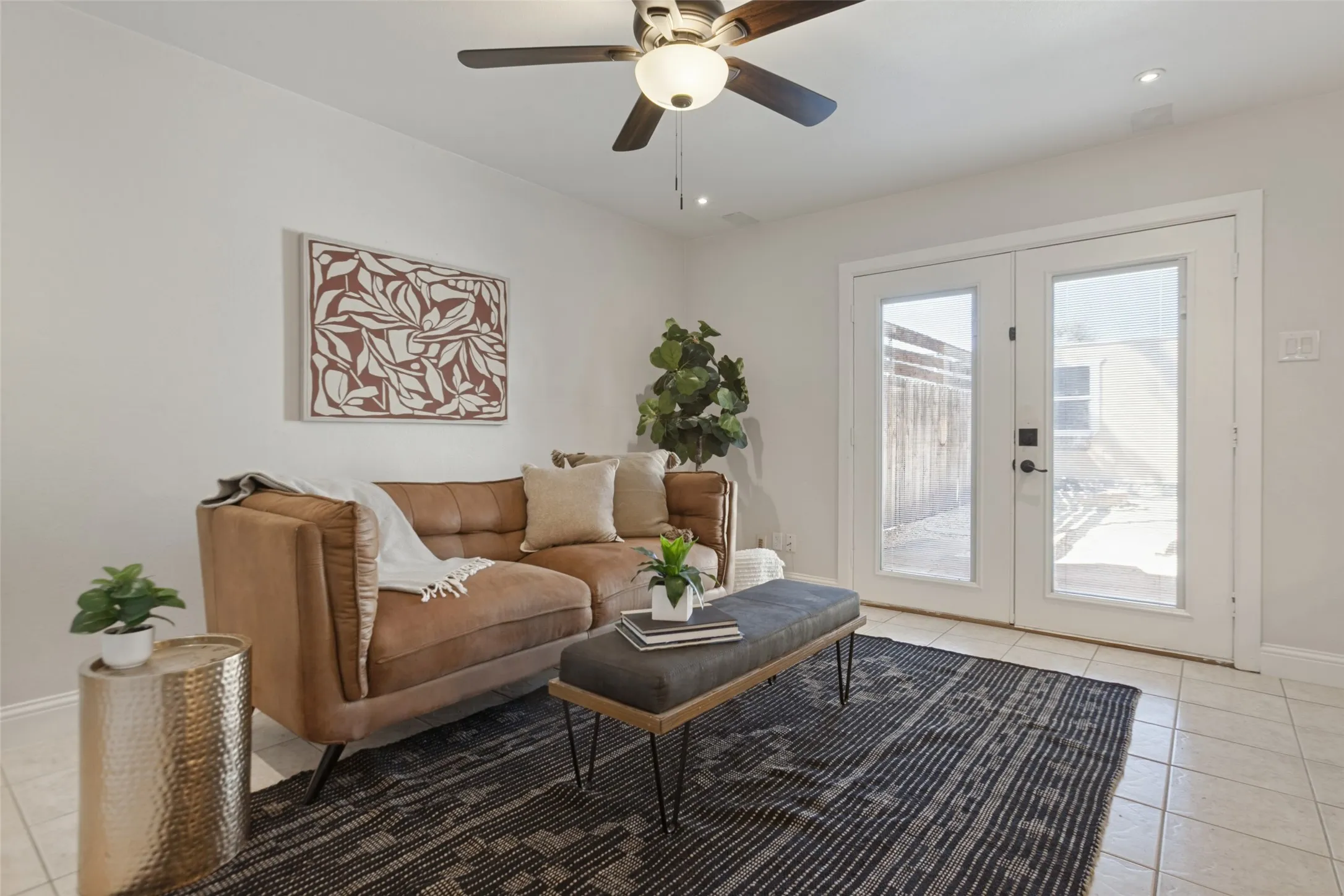 351 Vally Park Dr. - Updated living area featuring fresh paint, newer tile flooring, ceiling fan and French doors with built-in blinds that open to the back patio.
