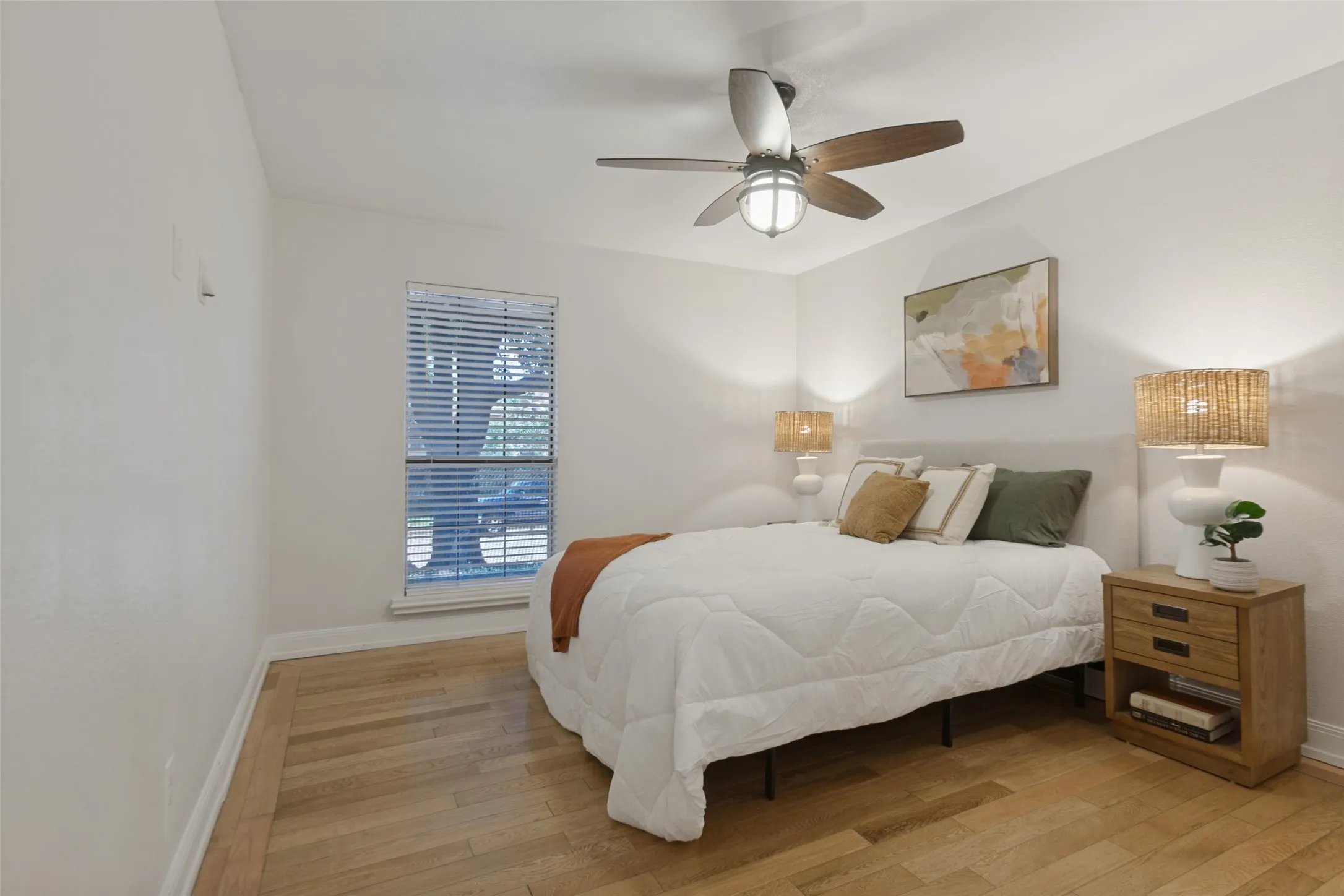 351 Vally Park Dr. - Spacious primary bedroom featuring a ceiling fan and wood-look flooring, creating a comfortable and inviting retreat.
