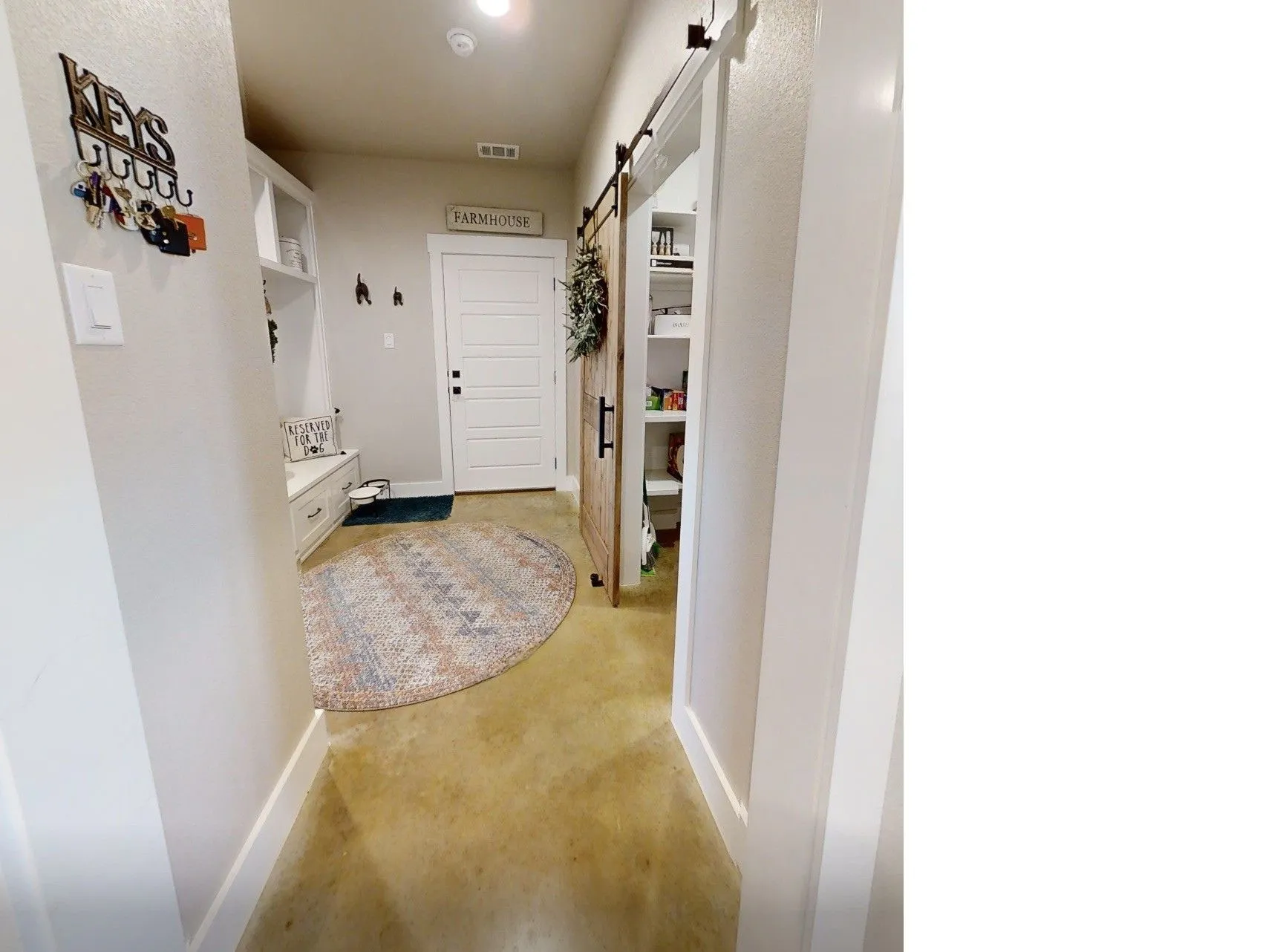 Muddrom/Hallway featuring a Pantry entrance, bench and rack