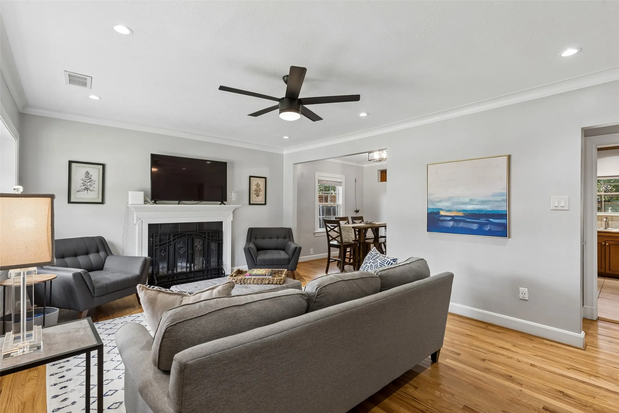 Hardwood flooring, recessed lighting, and a ceiling fan