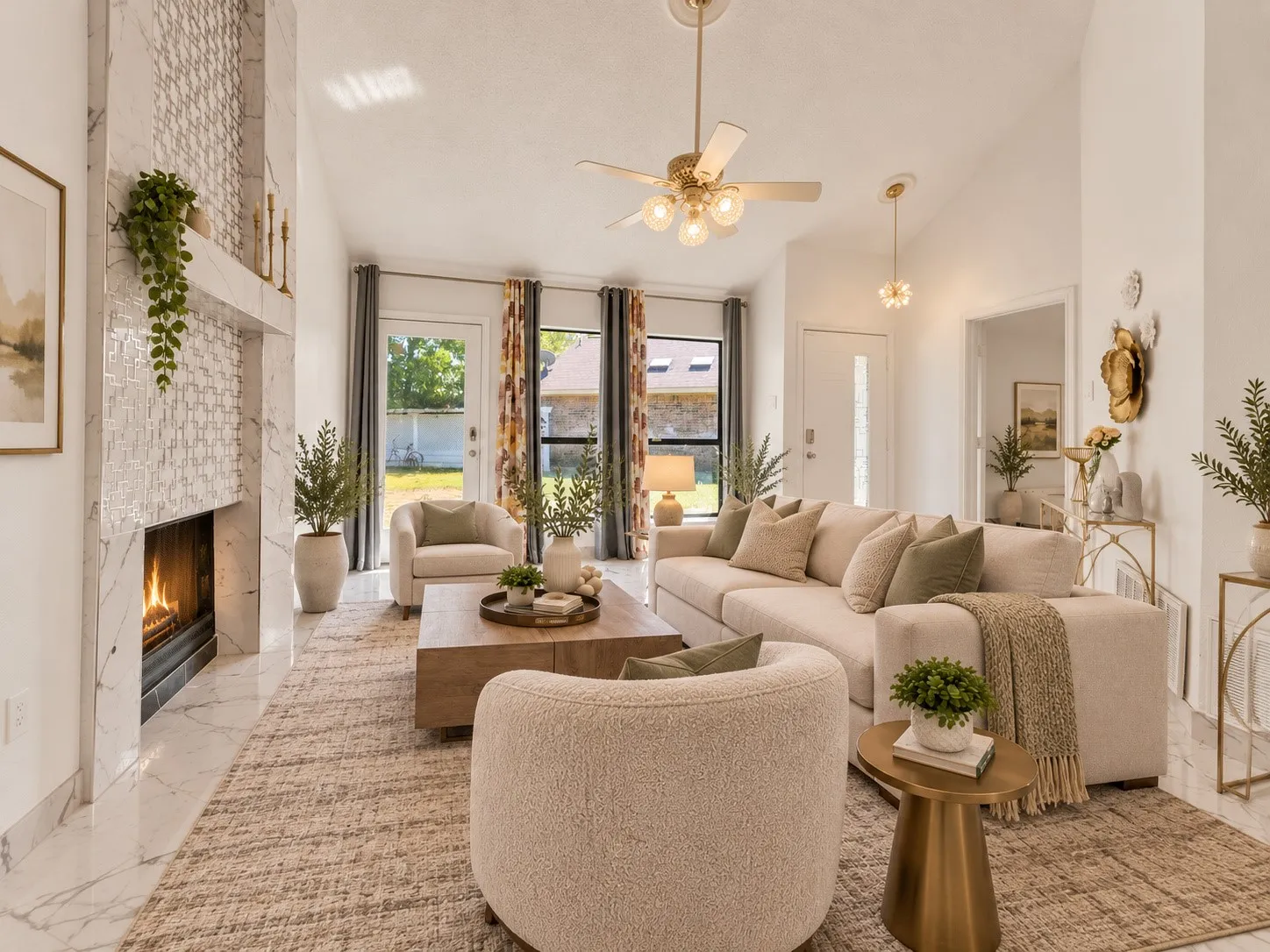Vaulted ceilings with a ceiling fan, a fireplace with a decorative tile surround, polished tile flooring, and a glass-paneled entry door