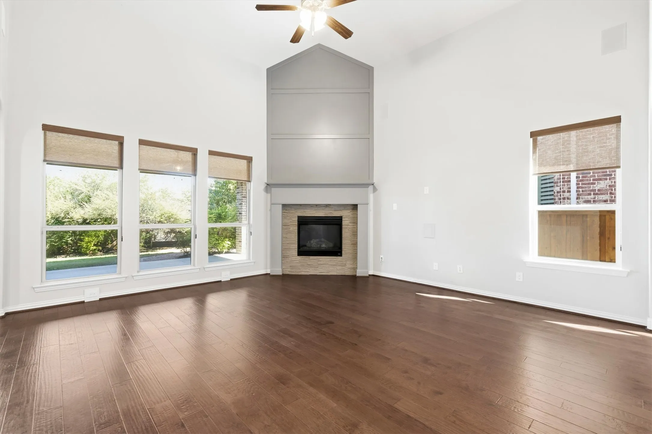 Hardwood floors, frieplace and natural light enhance this space.
