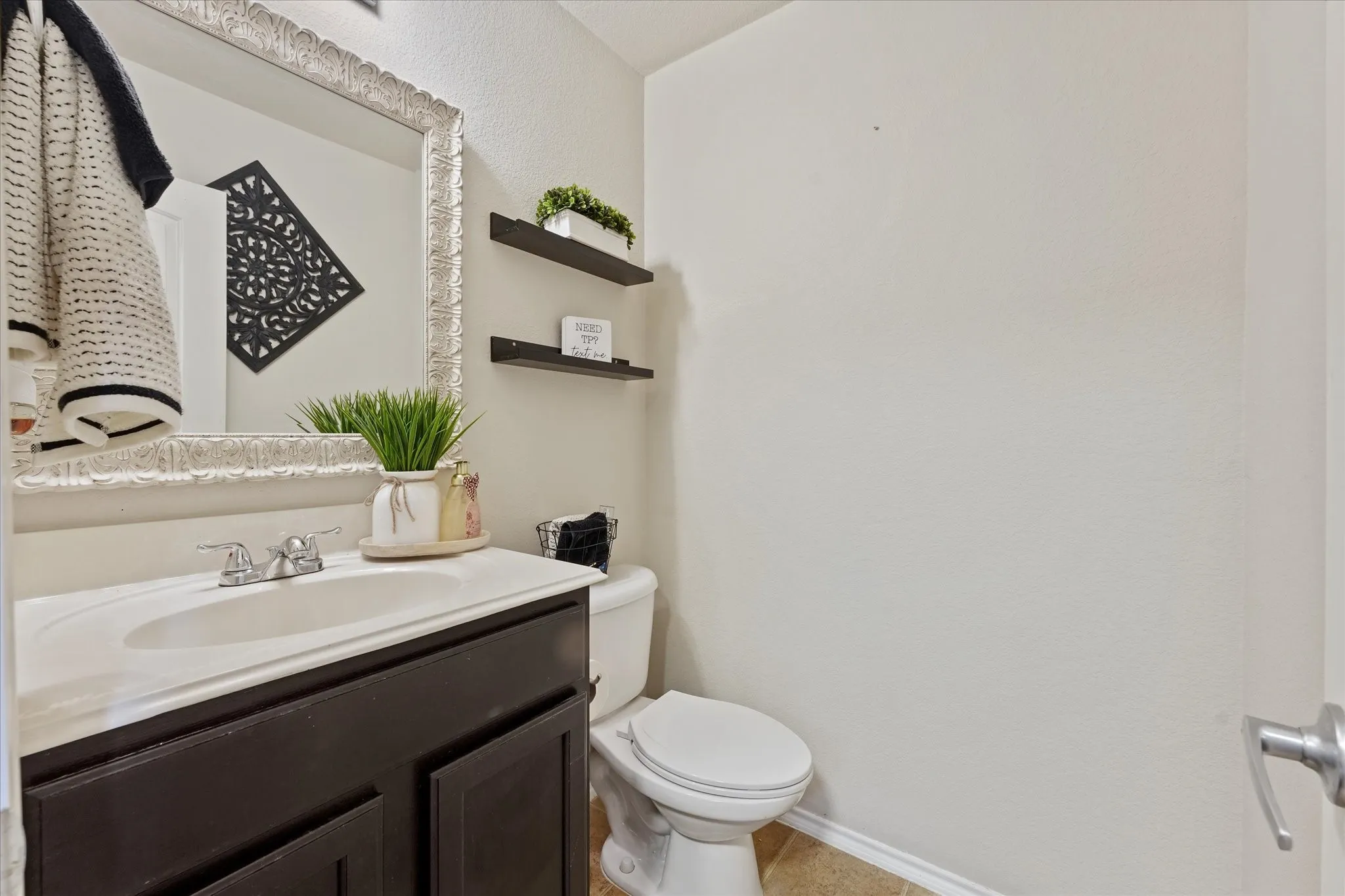 Built-in vanity with a single basin sink and dual-handle faucet