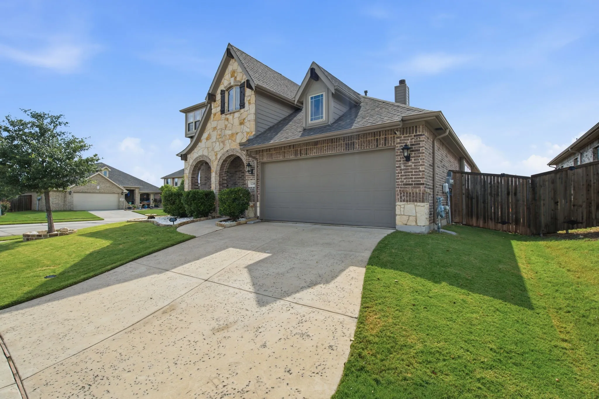 Stone and brick exterior with arched entryway