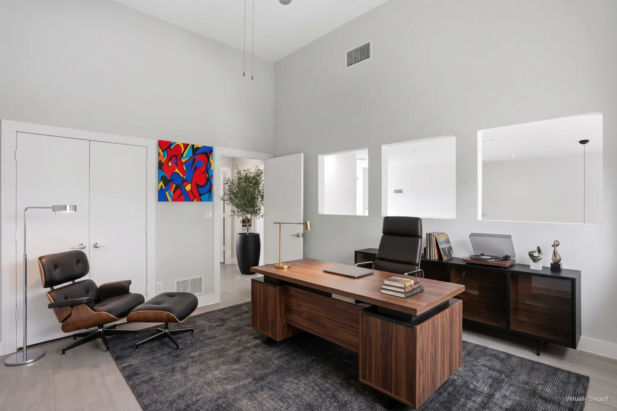 Bedroom three with double-door closet and interior transom windows that bring in extra light. Virtually staged.