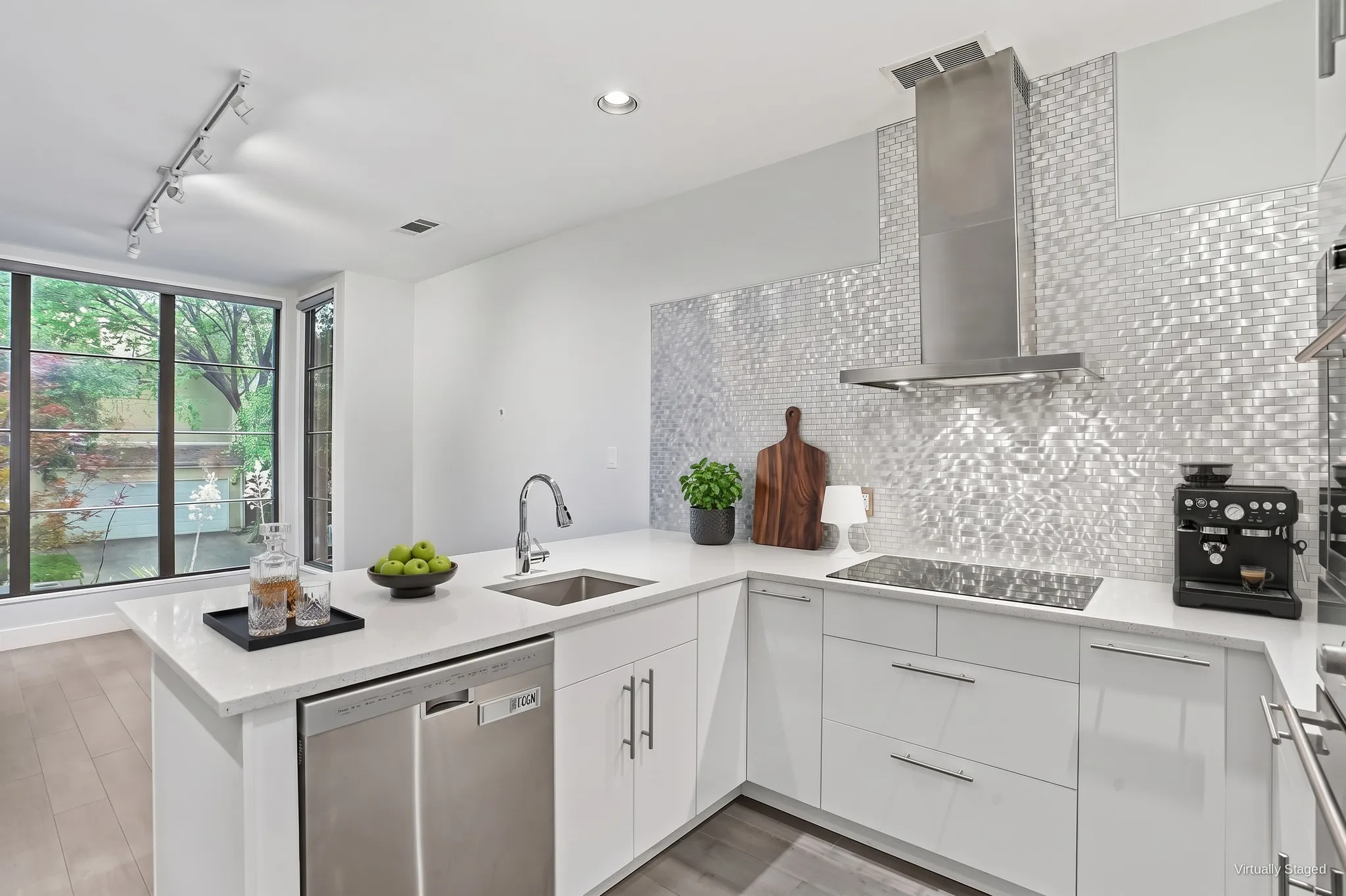 Updated kitchen with quartz countertops, a shimmering mosaic tile backsplash, stainless chimney hood, and high-gloss white cabinetry. Virtually staged.