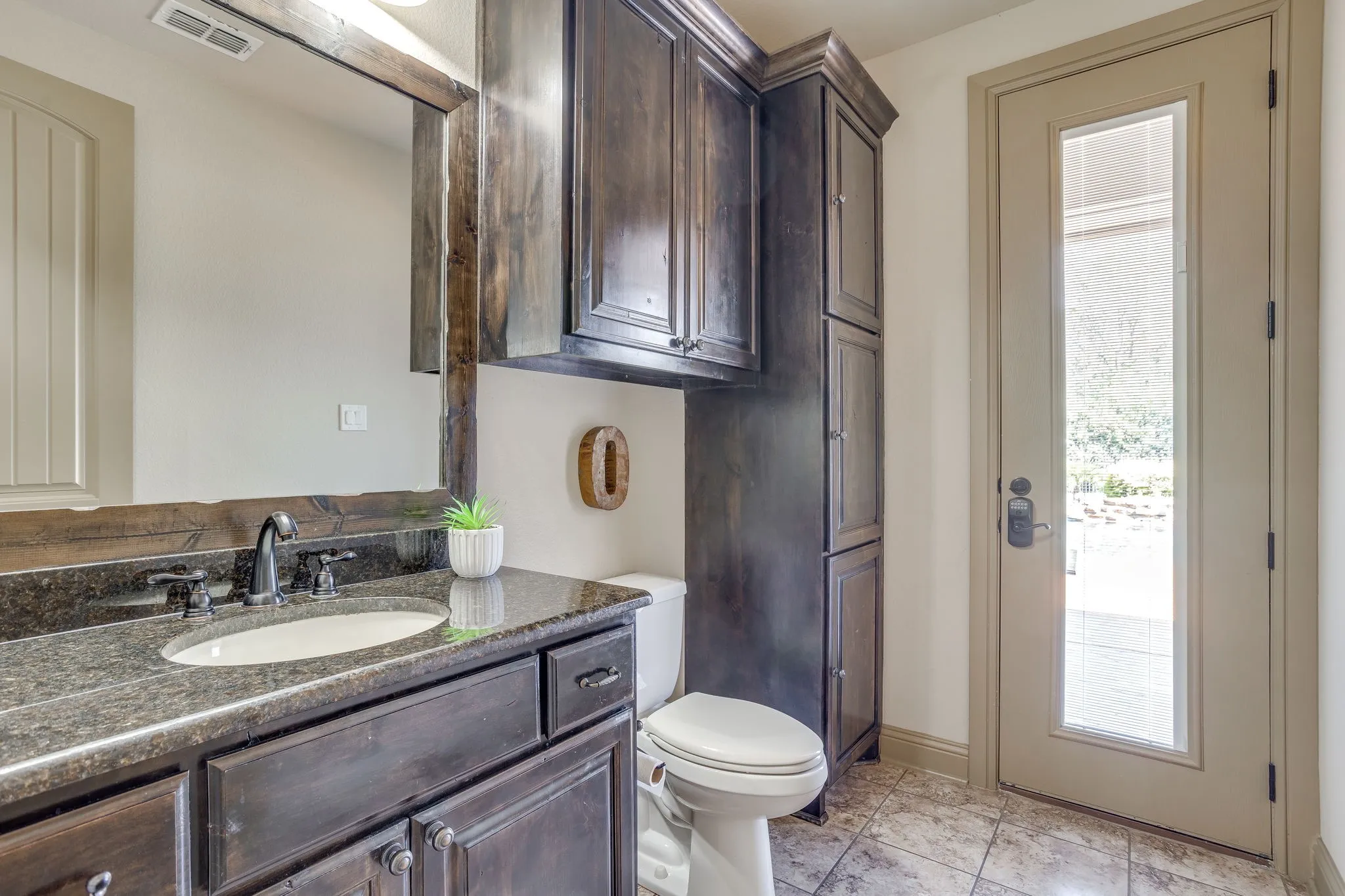 The powder bath opens to the outside and pool area.